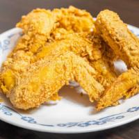 Fried Chicken Wings (4 Pcs) · Cooked wing of a chicken coated in sauce or seasoning.