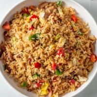 Chaufa · Sauteed fried rice mixed with meat of choice. Mixed with green scallions, red peppers and sh...