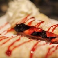 Wild Berry Crepe · Strawberries, blueberries, and raspberry topping. Sweet crepes are not served with syrup or ...