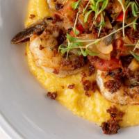 Shrimp + Grits · cheddar polenta, cajun tomato salsa, crispy premio chorizo