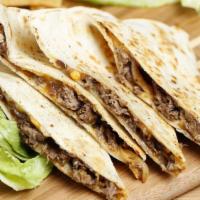 Steak Quesadilla · Flour tortilla filled with mozzarella cheese and a side of sour cream and pico de gallo.