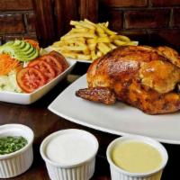 Whole Rotisserie Chicken · Served with fries and salad.