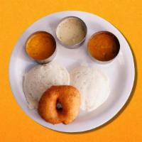 Rice Cake & Fritter Doughnuts  · 2 Idly and 1 vada served with relish and lentil soup.