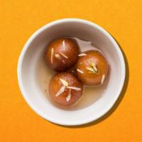Gulab Jamun · Softballs made of reduced milk, flour, and a leavening agent, dipped in syrup and served warm.