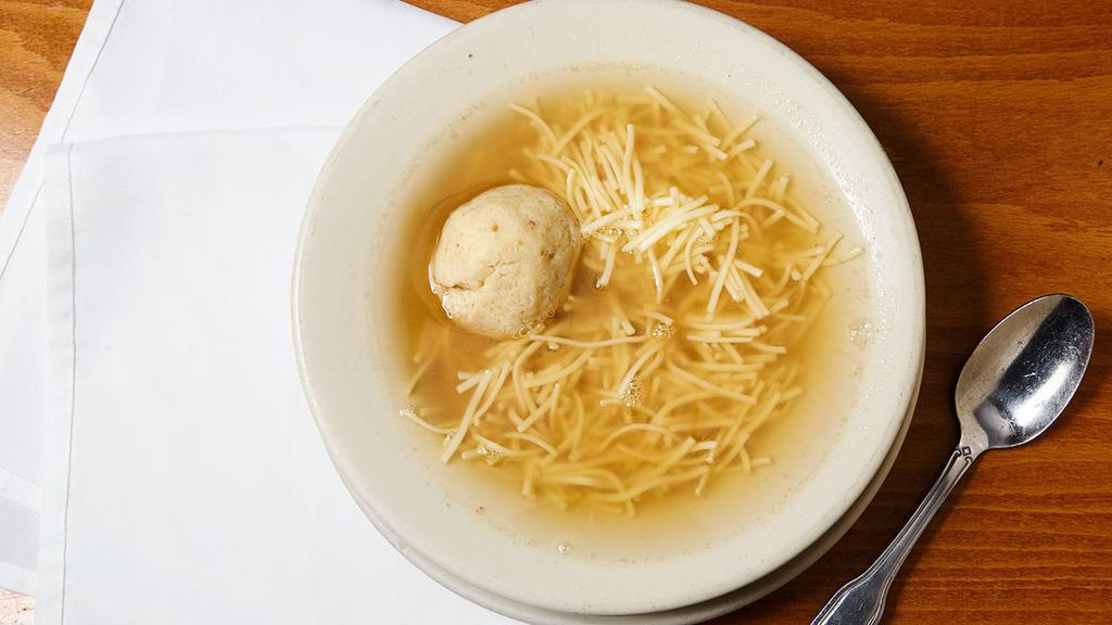 Matzoh Ball Soup · Served with noodles and Matzoh balls.