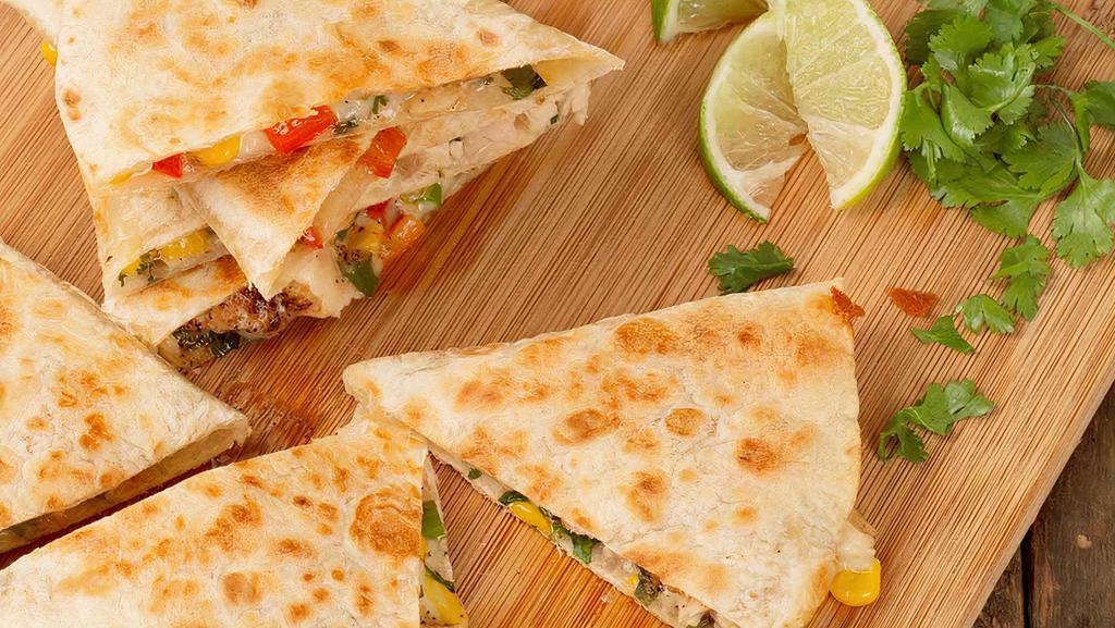 The Vegetarian Quesadilla · Grilled Peppers, Grilled Onions, Grilled Mushrooms, Broccoli, Corn with Mexican Style 4 Cheese Blend. Side of Sour Cream & Salsa.