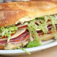 Italian Combination Sandwich · Salami, ham, pepperoni, fresh mozzarella cheese, onions, lettuce, tomatoes, roasted peppers ...