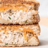 Tuna Melt · Fresh albacore tuna salad with melted yellow American cheese, lettuce and tomatoes.