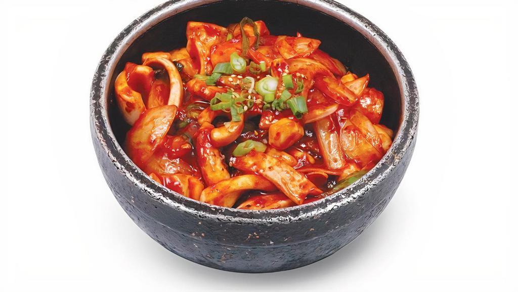 O Jinguh Bibim Bop · Spicy squid and vegetables in hot pot.