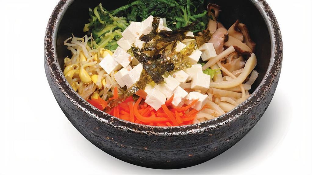 Tofu Bibim Bop · Tofu and vegetables in hot pot.