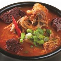 Hae Jang Guk · Spicy ox bone stew with ox blood and vegetables.