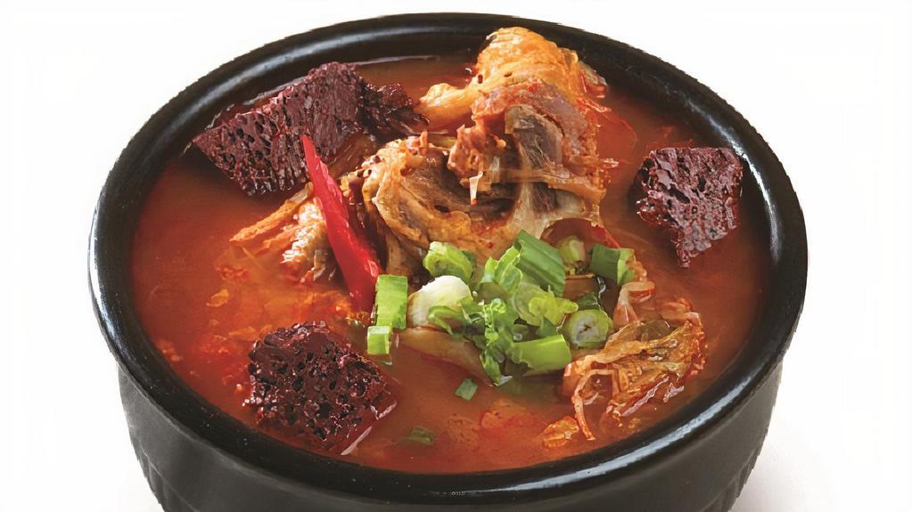 Hae Jang Guk · Spicy ox bone stew with ox blood and vegetables.