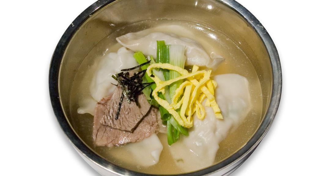 Dduk Mandoo Guk · Dumpling and rice cake soup.