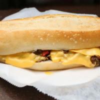 Philly Cheesesteak Sandwich · Grilled steak strips, grilled peppers and onions and melted American cheese.