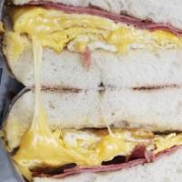 Taylor Ham, Eggs & Cheese · Delicious pork roll, eggs, and melted cheese on a plain bagel.