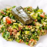 Taboule · Diced tomatoes mixed with finely chopped parsley, bulgur wheat all tossed with olive oil.