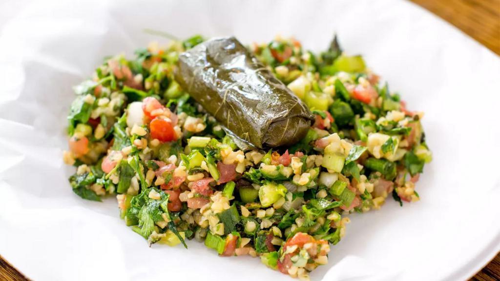 Taboule · Diced tomatoes mixed with finely chopped parsley, bulgur wheat all tossed with olive oil.