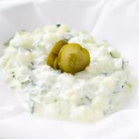 Tzatziki · Fresh diced cucumber mixed in organic yogurt with fresh mint leaves, dill and a hint of oliv...