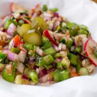 Fattoush · Diced tomatoes and cucumbers, sliced radishes and green peppers mixed with cilantro, fresh b...