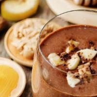 The Fit Smoothie · Chocolate whey protein, banana, almond butter, fresh almonds, and almond milk.