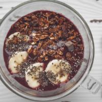 Nutella Açaí Bowl · Pure açaí topped with coconut flakes, strawberry, banana, granola, and nutella drizzle.