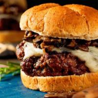 Mushroom Burger · Hearty charbroiled patty, melted swiss cheese, sautéed mushrooms, and crispy onions served b...