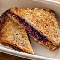 Hb Pb & J · Honeybrains raw wildflower honey, house blueberry compote, house peanut butter and 8 grain p...
