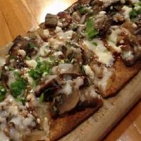 Truffled Mushroon Flat Bread  · Monterrey Jack Cheese Sautee Mushroom & caramelized onions Truffle Oil Fig Glaze