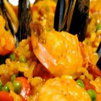 Seafood Paella · Saffron Rice/ Green Peas, Peppers, Clams, Mussels, Calamari, Shrimp &Chorizo