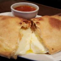 Pepperoni Calzone  · Mozzarella and ricotta cheese with Pepperoni inside of a perfect calzone crust