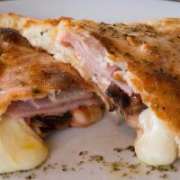 Ham Calzone  · Ham Calzone - Mozzarella and ricotta cheese inside of a perfect calzone crust - side of sauce