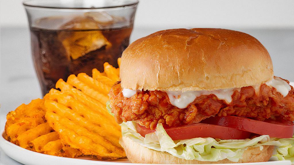 Buffalo Chicken Sandwich Meal · Grilled or Fried Chicken Breast, Served with Lettuce, Tomato, Blue Cheese, your Favorite Buffalo Flavor, Regular Waffle Fries, and a Drink! 1,050-2,451 cal.