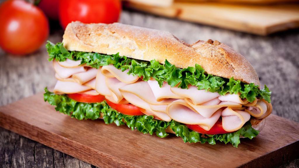 Smoked Turkey Sandwich · Delicious sandwich made with Smoked Turkey. Topped with lettuce, tomatoes, cheese, and mayonnaise.