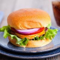 Cheeseburger · Delicious Cheeseburger freshly prepared and cooked to perfection. Topped with lettuce, tomat...