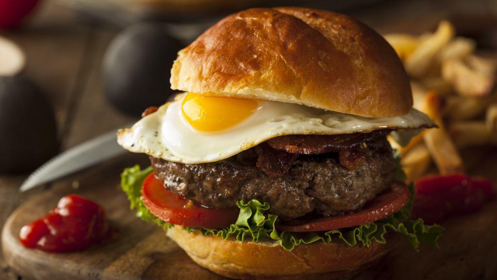 Texas Burger · Delicious Texas Burger freshly prepared and cooked to perfection. Made with Fried Egg, Jack cheese, and Jalapeños. Topped with lettuce, tomato, mayo, and ketchup.