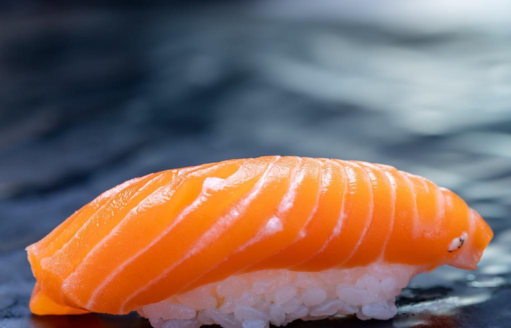 1 Piece King Salmon · Your choice of sliced fish served over rice (sushi) or sliced fish served without rice (sashimi). Brown rice not available.