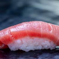 1 Piece Maguro · Tuna. Your choice of sliced fish served over rice (sushi) or sliced fish served without rice...