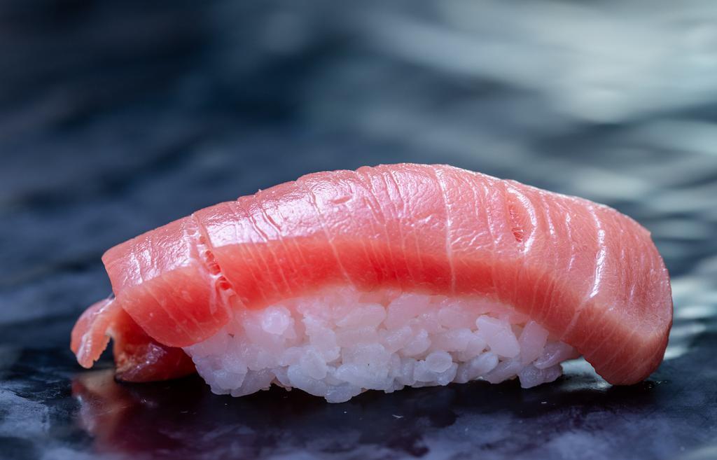 1 Piece Maguro · Tuna. Your choice of sliced fish served over rice (sushi) or sliced fish served without rice (sashimi). Brown rice not available.
