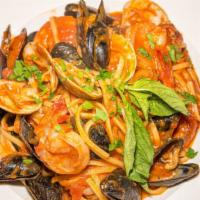 Linguine Pescatore · Shrimp, clams, and mussels served over in a bed of linguine in a plum tomato sauce.
