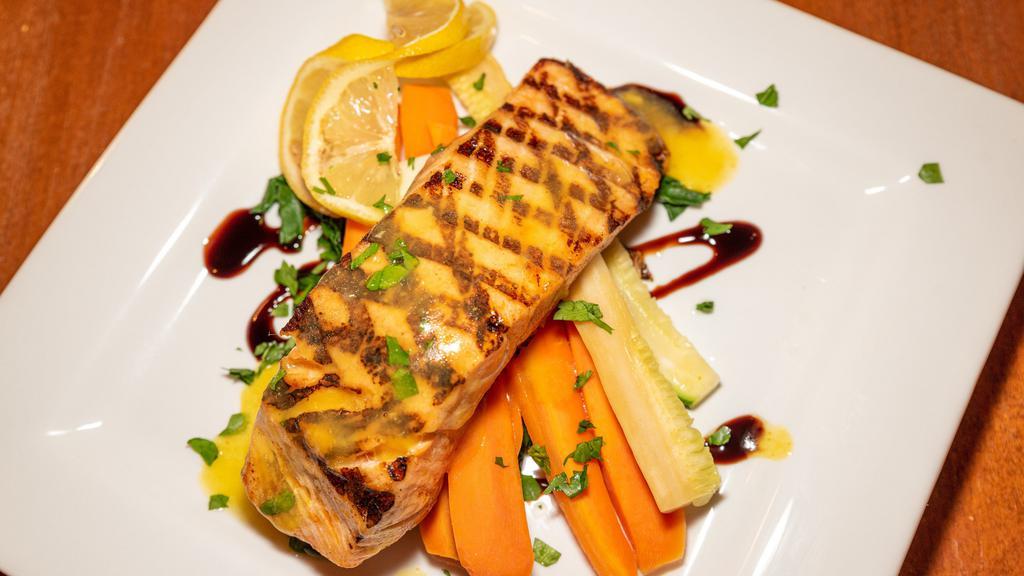 Salmon Cartoccia · Oven baked fresh salmon with fresh julienne vegetables served in a white wine lemon sauce.