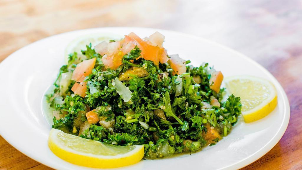  - Tabouli Salad · Wheat bulgur mixed with fresh parsley, tomatoes, onions, mint, fresh lemon juice and olive oil.