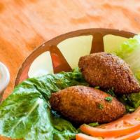  - Kibbeh Kras · Lebanon’s national dish. A mixture of lean beef and bulgur wheat filled with a mixture of gr...