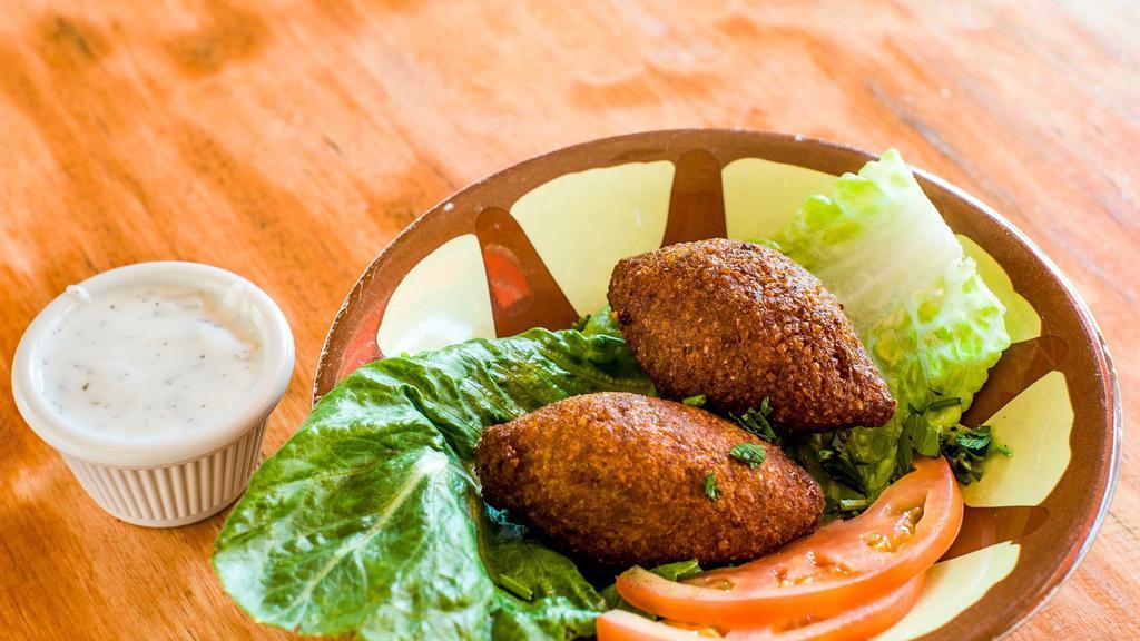  - Kibbeh Kras · Lebanon’s national dish. A mixture of lean beef and bulgur wheat filled with a mixture of ground beef, diced onions and pine nuts.
