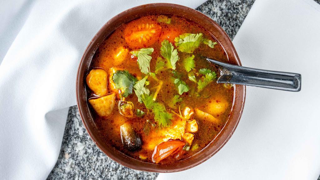 Tom Yum Soup · Spicy. Savory sour soup with mushrooms, lemongrass, lime leaves, tomatoes, and chilis.