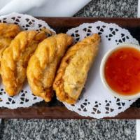 Potato Curry Puff · Pastry puff stuffed with potatoes and curry powder.