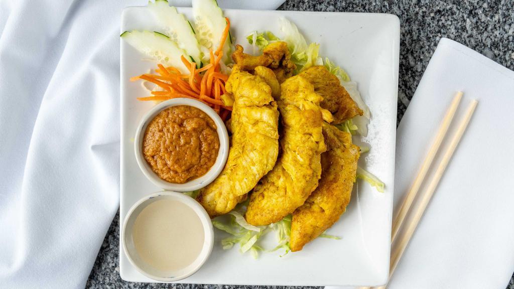 Chicken Satay · With peanut sauce and cucumber sauce.