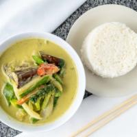 Green Curry · Spicy. Served with jasmine rice. Green curry paste, coconut, bell peppers, zucchinis, eggpla...