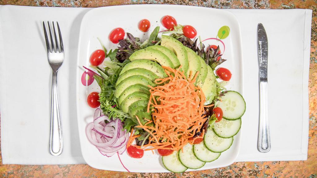 Avocado · With mixed greens, carrots, red onions, tomatoes, and lemon vinaigrette dressing.