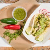 Grilled Chicken · With cilantro, onions, homemade guacamole and tomatillo sauce.