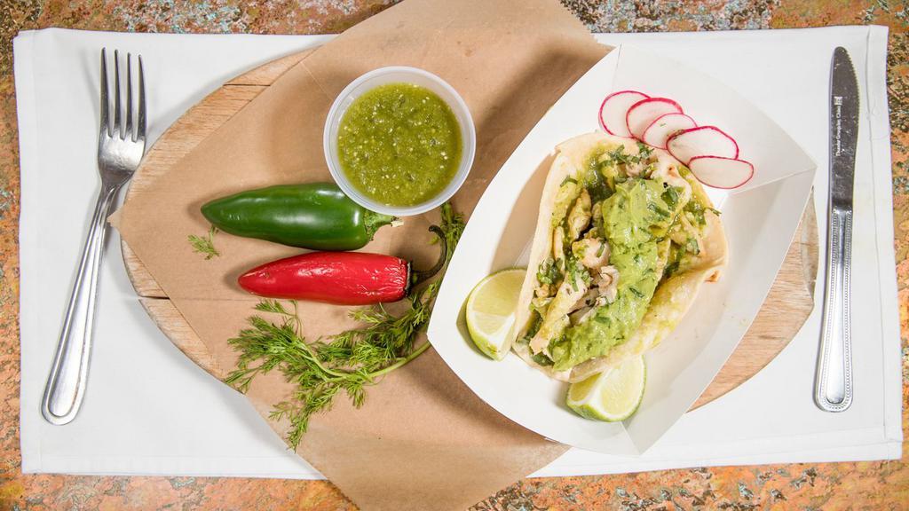 Grilled Chicken · With cilantro, onions, homemade guacamole and tomatillo sauce.